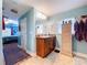 Comfortable bathroom boasts ample counter space, wood cabinetry, and coordinated decor at 9152 Bunting Rd, Weeki Wachee, FL 34613