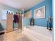 Relaxing bathroom with a soaking tub, walk-in shower, and ample storage space at 9152 Bunting Rd, Weeki Wachee, FL 34613
