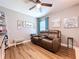 Comfortable den with hardwood floors, seating, and a view of the backyard at 9152 Bunting Rd, Weeki Wachee, FL 34613