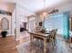 Elegant dining room boasting chandelier, rug, and comfortable seating at 9152 Bunting Rd, Weeki Wachee, FL 34613