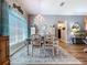Elegant dining room with a chandelier, a decorative rug, and seating for four people at 9152 Bunting Rd, Weeki Wachee, FL 34613