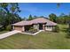 Charming single-story home with a well-manicured lawn and neutral-colored exterior paint at 9152 Bunting Rd, Weeki Wachee, FL 34613
