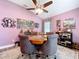 Game room showcasing hardwood floors, artwork, comfortable chairs, and ceiling fan at 9152 Bunting Rd, Weeki Wachee, FL 34613