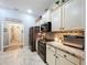 Kitchen showcasing modern stainless steel appliances and ample cabinet space at 9152 Bunting Rd, Weeki Wachee, FL 34613