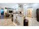 Open kitchen layout showcasing granite countertops, pendant lighting, and seamless flow to living areas at 9152 Bunting Rd, Weeki Wachee, FL 34613