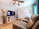 Inviting living room with a large TV, recliners, and natural light at 9152 Bunting Rd, Weeki Wachee, FL 34613