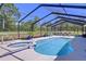 Backyard pool area with a spa and lounge chairs surrounded by greenery at 9152 Bunting Rd, Weeki Wachee, FL 34613