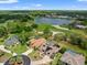 Beautiful aerial view of a community overlooking a lake and golf course at 9161 Southern Comfort Ct, Weeki Wachee, FL 34613
