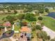 Picturesque aerial view featuring a home near a golf course with mature trees and lush landscaping at 9161 Southern Comfort Ct, Weeki Wachee, FL 34613