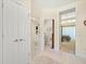 Neutral bathroom featuring a walk-in shower and a view of the primary bedroom at 9161 Southern Comfort Ct, Weeki Wachee, FL 34613