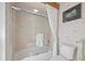 Bathroom featuring a shower and tub combination behind a glass enclosure at 9161 Southern Comfort Ct, Weeki Wachee, FL 34613