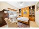 Comfortable bedroom featuring built-in shelving, cabinets, and a Murphy Bed at 9161 Southern Comfort Ct, Weeki Wachee, FL 34613