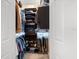 Walk-in closet with custom storage system to maximize space and organization at 9161 Southern Comfort Ct, Weeki Wachee, FL 34613