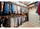 Walk-in closet with plentiful shelving and hanging storage solutions at 9161 Southern Comfort Ct, Weeki Wachee, FL 34613