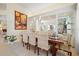 Beautiful dining room featuring modern lighting, built-in shelving and a large area rug at 9161 Southern Comfort Ct, Weeki Wachee, FL 34613