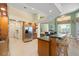 A kitchen with an island and barstool seating at 9161 Southern Comfort Ct, Weeki Wachee, FL 34613