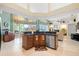 Bright eat-in kitchen with an island, stainless steel appliances, and views to the backyard at 9161 Southern Comfort Ct, Weeki Wachee, FL 34613