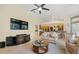 Open-concept living room connects to the kitchen with access to backyard and plenty of space at 9161 Southern Comfort Ct, Weeki Wachee, FL 34613