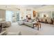 Open-plan living space with neutral decor and access to the outdoor patio at 9161 Southern Comfort Ct, Weeki Wachee, FL 34613