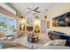 The living room has natural light, built-in shelving, fireplace and access to the backyard at 9161 Southern Comfort Ct, Weeki Wachee, FL 34613