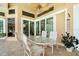 Covered outdoor patio space offers a dining area, fan, and sliding glass doors to let in natural light at 9161 Southern Comfort Ct, Weeki Wachee, FL 34613