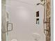 Walk-in shower with decorative tile accent and a built-in shampoo niche at 9161 Southern Comfort Ct, Weeki Wachee, FL 34613