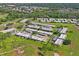 An aerial view shows the layout of this golf course community at 9622 Brassie Ct # 9, New Port Richey, FL 34655