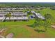 Golf course community aerial view with the meticulously maintained landscaping and green fairways at 9622 Brassie Ct # 9, New Port Richey, FL 34655
