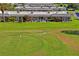 Expansive green backyard views of the residences of the golf course community at 9622 Brassie Ct # 9, New Port Richey, FL 34655