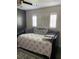 Cozy bedroom seating area with decorative pillows, shudders, and comfortable cushions at 9622 Brassie Ct # 9, New Port Richey, FL 34655