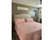 Comfortable bedroom featuring a plush bed, neutral walls, and ceiling fan at 9622 Brassie Ct # 9, New Port Richey, FL 34655