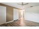 Spacious bedroom with ceiling fan, closet, and wood-look flooring at 9622 Brassie Ct # 9, New Port Richey, FL 34655