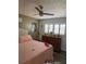 Comfortable bedroom featuring a plush bed, neutral walls, dresser and ceiling fan at 9622 Brassie Ct # 9, New Port Richey, FL 34655