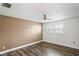 Bedroom with wood-look flooring and window with plantation shutters at 9622 Brassie Ct # 9, New Port Richey, FL 34655