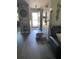 Bright entryway featuring a charming foyer with a decorative mirror and a cozy pet bed at 9622 Brassie Ct # 9, New Port Richey, FL 34655