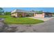 Inviting home exterior with a well-manicured lawn and a convenient carport at 9622 Brassie Ct # 9, New Port Richey, FL 34655
