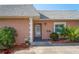 Charming home entrance with decorative features and well-maintained landscaping at 9622 Brassie Ct # 9, New Port Richey, FL 34655