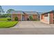 Charming single-story home with a well-kept lawn and inviting front entrance at 9622 Brassie Ct # 9, New Port Richey, FL 34655