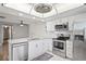 Bright kitchen featuring modern stainless steel appliances and a granite island at 9622 Brassie Ct # 9, New Port Richey, FL 34655