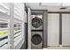 Convenient laundry closet with a stackable washer and dryer at 9622 Brassie Ct # 9, New Port Richey, FL 34655