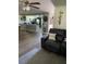 Inviting living room flows into a modern kitchen with sleek appliances and stylish gray accents at 9622 Brassie Ct # 9, New Port Richey, FL 34655