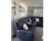 Relaxing living room featuring a large sectional sofa complemented by plantation shutters at 9622 Brassie Ct # 9, New Port Richey, FL 34655