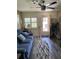 Cozy sunroom with plantation shutters, leading to a screened lanai with outdoor seating at 9622 Brassie Ct # 9, New Port Richey, FL 34655