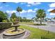 Scenic water fountain in lush landscaped yard at 9622 Brassie Ct # 9, New Port Richey, FL 34655
