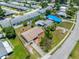 Aerial view of a home with fenced yard, showing proximity to neighborhood streets and community amenities at 9891 52Nd N St, Pinellas Park, FL 33782