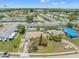 Aerial view of single Gathering home with fenced backyard, beautiful landscaping, and well-maintained surroundings at 9891 52Nd N St, Pinellas Park, FL 33782