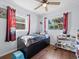 bedroom featuring dark wood floors, and a play storage at 9891 52Nd N St, Pinellas Park, FL 33782