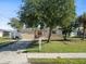 Charming single-story home with a well-maintained front yard, healthy lawn, and mature landscaping at 9891 52Nd N St, Pinellas Park, FL 33782