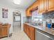 Updated kitchen featuring granite countertops, tiled backsplash, and stainless steel appliances at 9891 52Nd N St, Pinellas Park, FL 33782