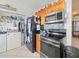 Compact kitchen design featuring stainless steel appliances and wooden cabinets at 9891 52Nd N St, Pinellas Park, FL 33782
